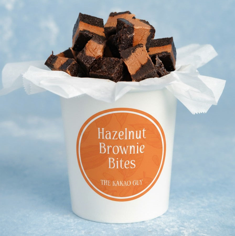 Hazelnut Brownie Bites by The Kakao Guy. Incredibly decadent with a rich hazelnut flavour. These delectable square brownie bites are a harmonious fusion of rich, fudgy brownie goodness and a luscious hazelnut center