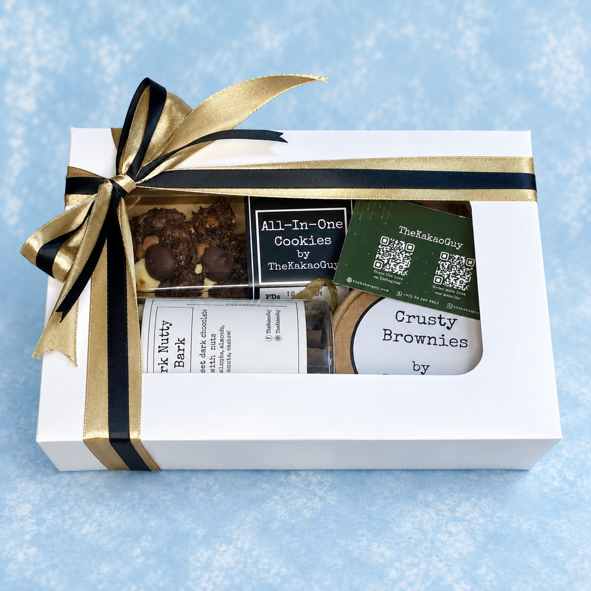 Crafted for special occassions and box wrapped in a ribbon with a handwritten note, by The Kakao Guy. Perfect for gifting, and contains a selection of the finest chocolate bark, cookies and brownies