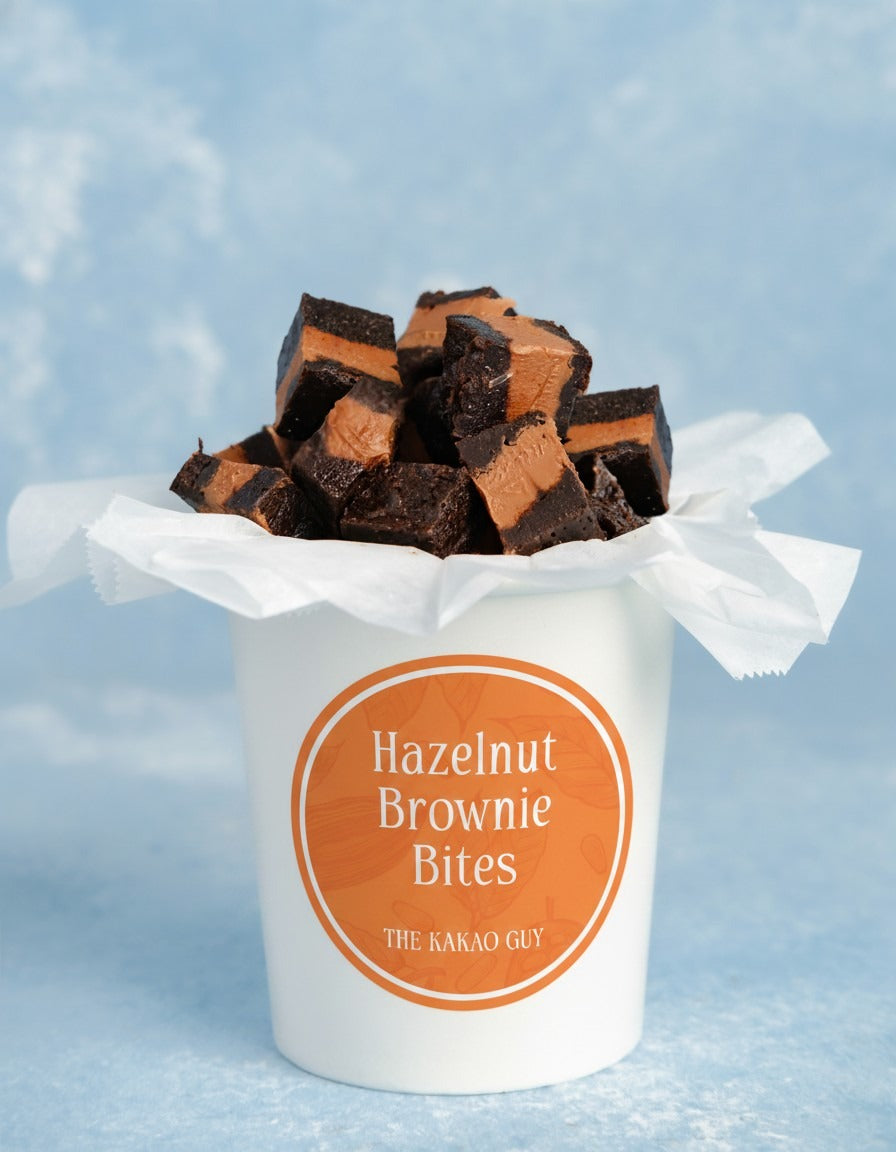 Hazelnut Brownie Bites by The Kakao Guy. Incredibly decadent with a rich hazelnut flavour. These delectable square brownie bites are a harmonious fusion of rich, fudgy brownie goodness and a luscious hazelnut center